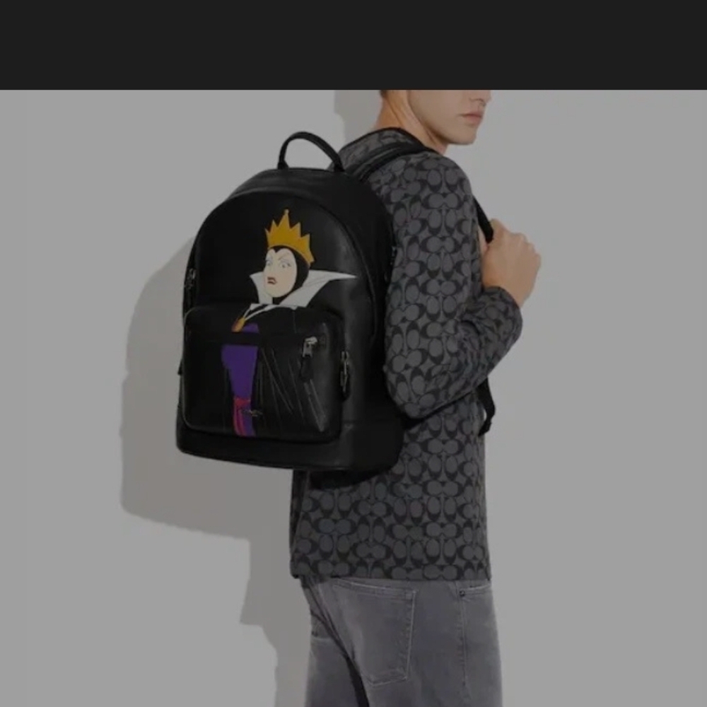 Coach Black Leather Backpack with Villain Portrait and Purple Accent